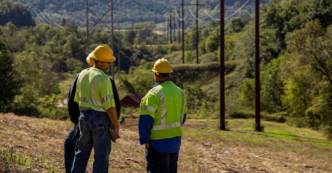 construction-workers-power-lines-daytime